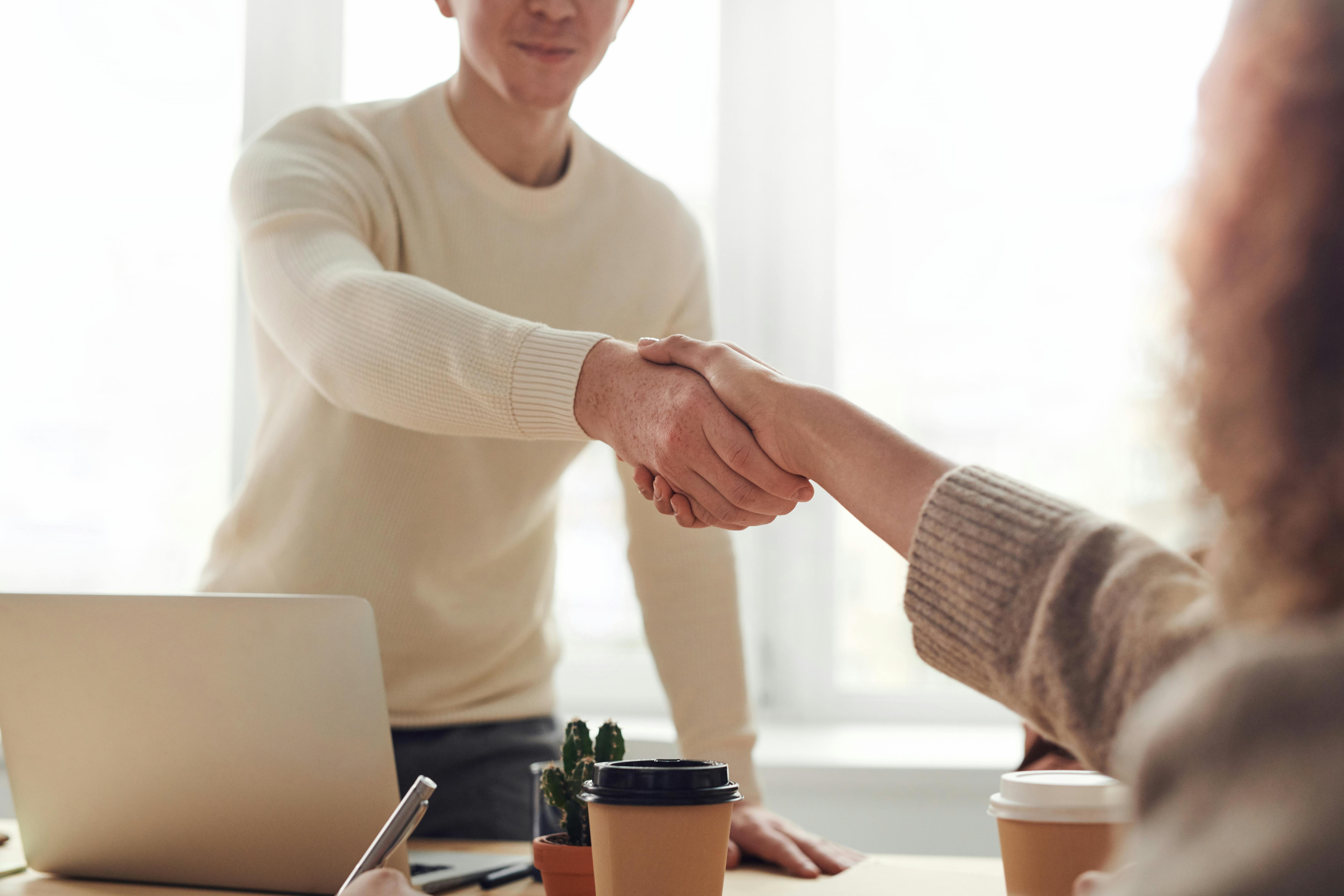 people doing hand shake